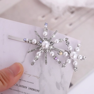 Elegant silver snowflake hair clip with white pearls and sparkling rhinestones for women