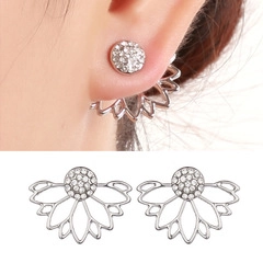 Detailed view of silver daisy stud earrings with sparkling white crystals for women