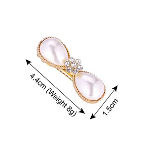 Elegant gold metal hair clip with pearl water drops and rhinestone flower center