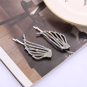 Barrettes à cheveux élégantes en forme d'ailes avec strass brillants et finition argentée