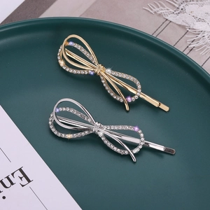 Barrettes à cheveux nœud étincelant avec strass en finitions or et argent