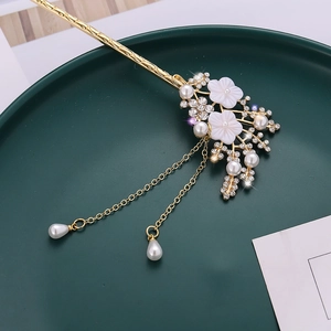 Elegant gold flower hair stick with pearls and rhinestones featuring long tassel charms