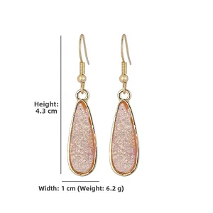 Detail view of gold resin druzy teardrop earrings with dimensions 4.3cm by 1cm