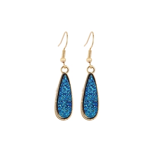 Detail of dark blue druzy resin drop earrings with elegant golden metal hooks