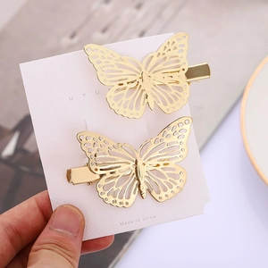 Elegant hollow butterfly hair clip set in shiny golden metal finish for women