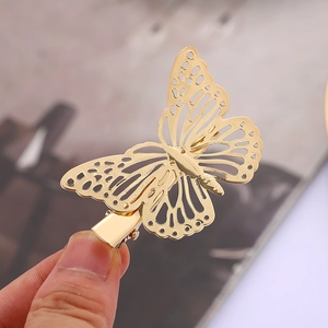 Elegant hollow golden butterfly hair clip for women with detailed metal craftsmanship