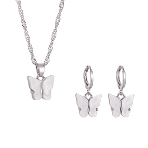 Silver butterfly jewelry set with iridescent white resin wings, necklace and earrings