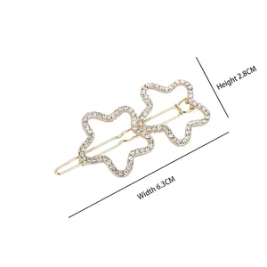 Fermaglio per capelli a doppia stella dorata con strass, larghezza 6.3cm e altezza 2.8cm