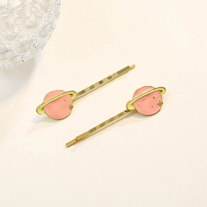 Ensemble de barrettes planète rose avec épingles dorées et design cosmique de rêve