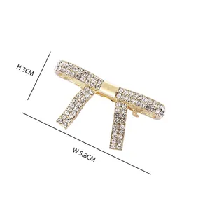 Eleganter goldener Haarschmuck aus Legierung mit glitzernden Strasssteinen Schleife