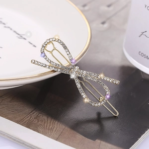 Barrette à cheveux élégante en forme de nœud ornée de strass brillants sur alliage
