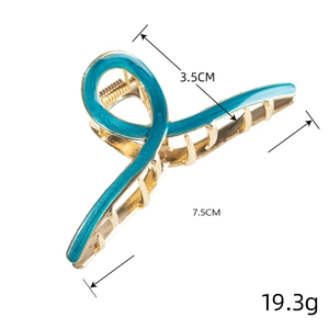 Detailed view of 7.5cm blue enamel geometric hair claw clip with gold metal frame