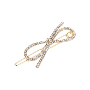 Barrette à cheveux élégante en forme de nœud doré avec strass blancs étincelants