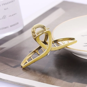 Elegant gold-tone geometric metal hair claw clip for women in Korean minimalist style