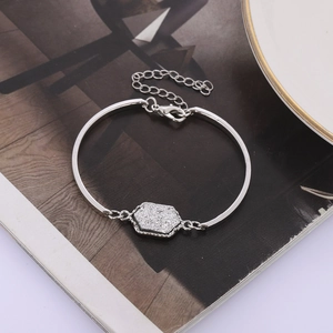 Detail of silver resin bangle with hexagonal druzy glitter and adjustable lobster clasp