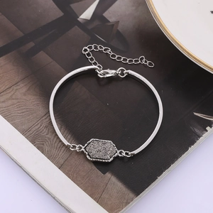 Detailed view of silver hexagon bracelet with druzy stone and adjustable lobster clasp
