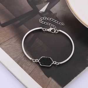 Detail of silver chain bracelet with hexagonal black druzy stone and adjustable clasp