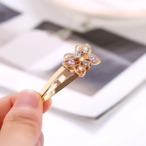 Elegante horquilla de lazo dorado para mujer con brillantes diamantes de imitación púrpuras