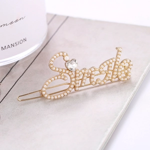Pince à cheveux Smile dorée élégante avec perles blanches et détail strass en forme de cœur