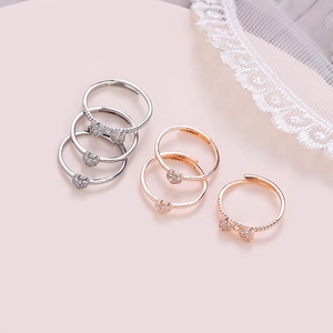 Set of six adjustable clover and heart rings in silver and rose gold finish