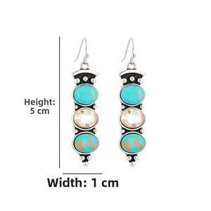 Detail of vintage silver earrings with turquoise stones and champagne crystal drop, 5x1cm