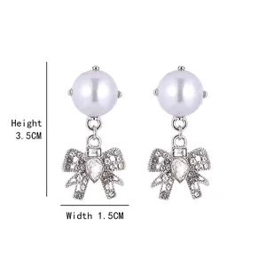 Elegant 925 silver needle pearl bow earrings with sparkling rhinestones and teardrop stones
