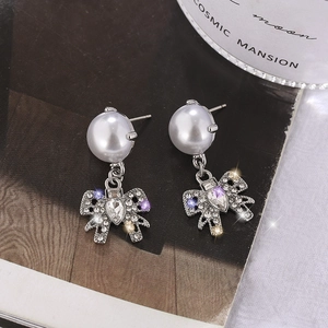 Vintage style bow knot pearl earrings with sparkling rhinestones in a silver finish