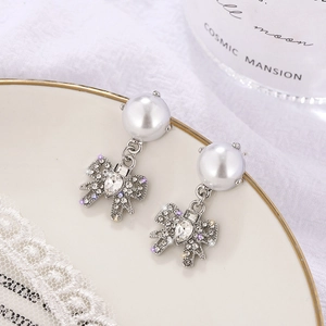 Elegant bow knot pearl drop earrings with sparkling crystals for a trendy look