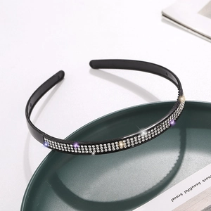Elegant black headband with three rows of sparkling silver rhinestones and anti-slip teeth