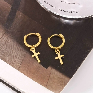 S925 sterling silver gold plated cross drop earrings on an elegant background