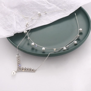 Elegant silver pearl headband with rhinestone tassel pendant for wedding celebrations