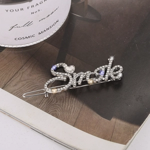 Elegant silver-toned Smile letter hair clip with sparkling rhinestones and heart detail