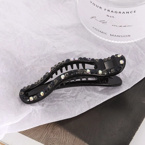 Elegant black duckbill hair clip with sparkling rhinestones and a secure inner comb design