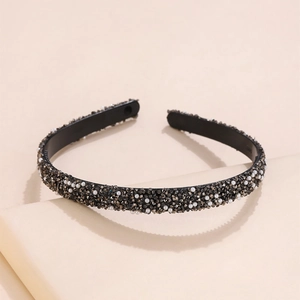 Elegant black headband with dark rhinestones and white pearls for a sophisticated look