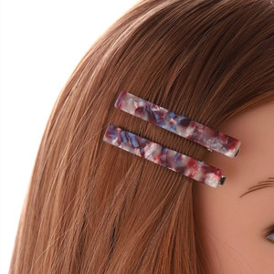 Elegant marble pattern acetate hair pins set for women styled on brown hair