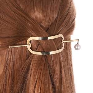 Minimalist gold geometric hair pin with a white pearl charm for modern hair styling
