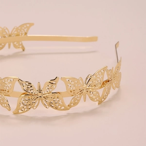Elegante cerchietto per capelli con farfalle dorate e design filigranato in metallo