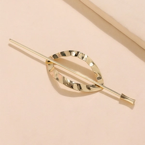 Golden minimalist metal hair pin with textured water ripple oval leaf design