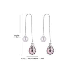 Detail view of silver drop earrings with pink water drop charms and pearl accents