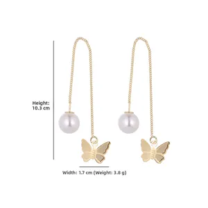 Detail view of gold butterfly pearl earrings showing dimensions 10.3cm height and 3.8g weight
