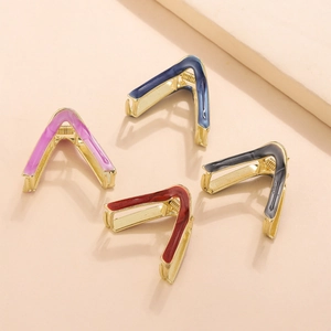 Close-up of four V-shaped alloy hair clips with enamel finish in multiple colors