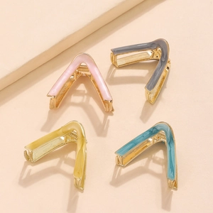 Elegant gold metal V-shaped hair claws in pastel pink, grey, yellow, and teal tones