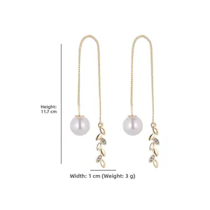 Golden threader earrings with pearl and leaf charms measuring 11.7 cm in length