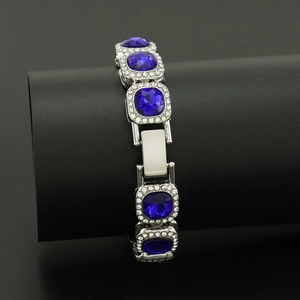Hip hop silver bracelet featuring square blue crystals surrounded by white rhinestones
