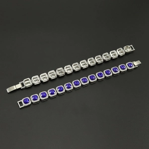 Detail view showing front and back of Cuban link chain with blue square zircon and micro-pave diamonds