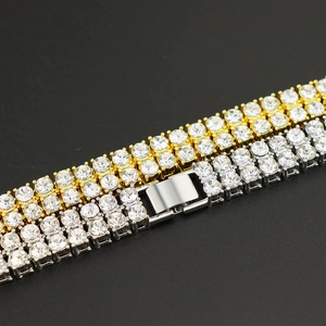 Close-up of two-tone hip hop tennis bracelet featuring triple rows of CZ stones