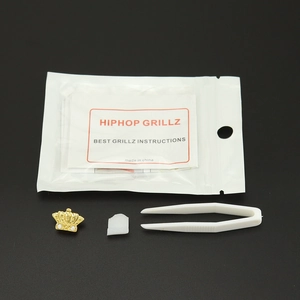 Set grillz dente singolo a corona d'oro con pinzette e barra di fissaggio hiphop