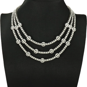 Three-layer silver tennis chain necklace with sparkling crystal encrusted smiley faces
