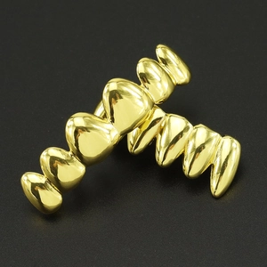 Hip hop 18k gold plated vampire teeth grillz with a polished mirror finish for adults