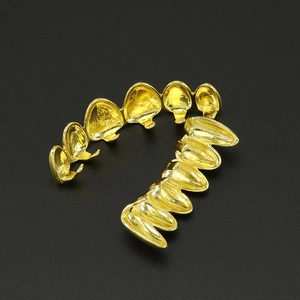 Polished 18k gold plated hip hop grillz set featuring top and bottom vampire fangs